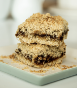 Date squares stacked on a plate